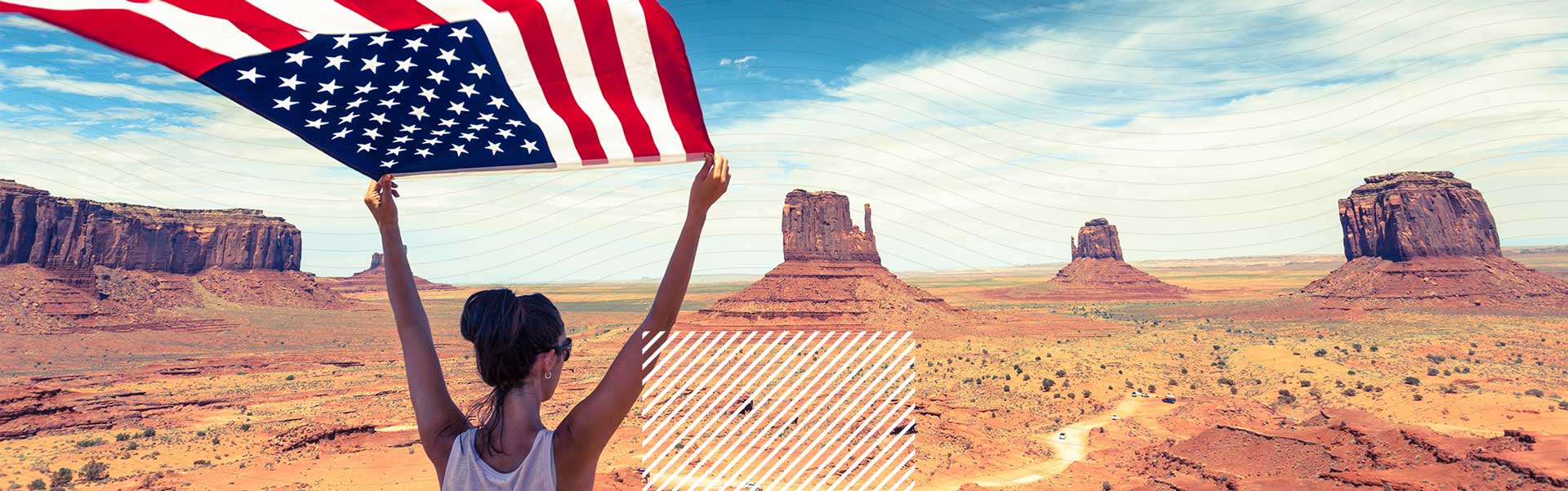 woman holding usa flag in desert