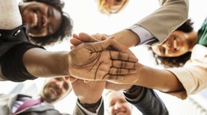 people putting hands together