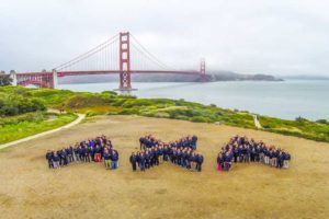 people forming axa logo in SF