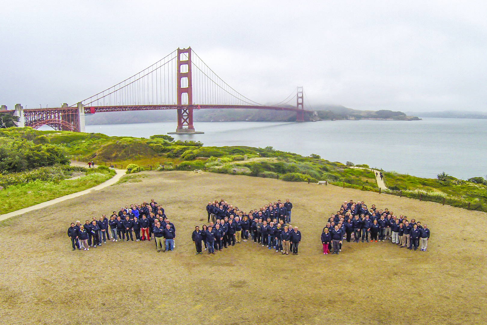 people forming axa logo in SF