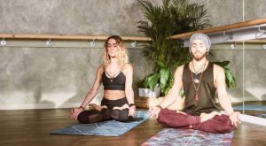 man and woman meditating