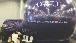 Women at meditation station at trade show