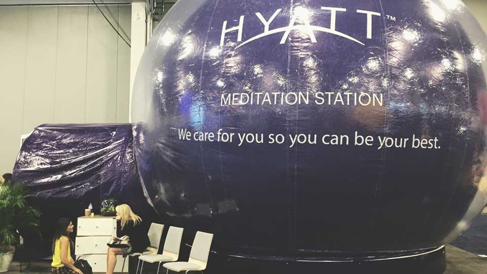 Women at meditation station at trade show