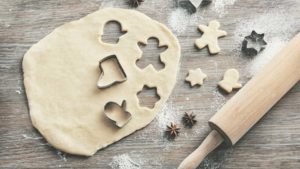 Wooden cutting board with cookie dough