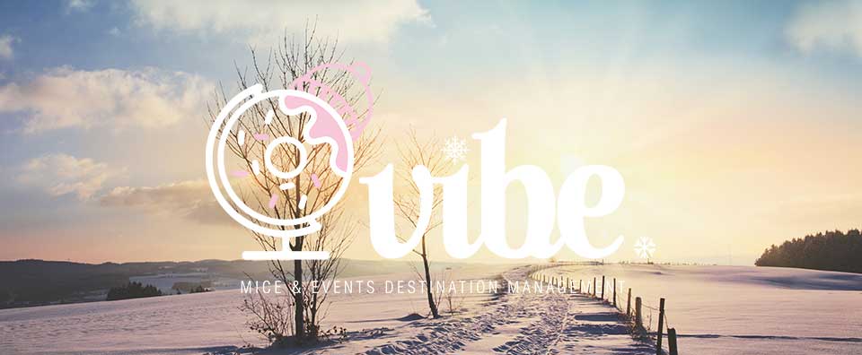 A sunset over a body of a snowy landscape