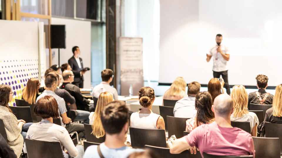 man talking on stage