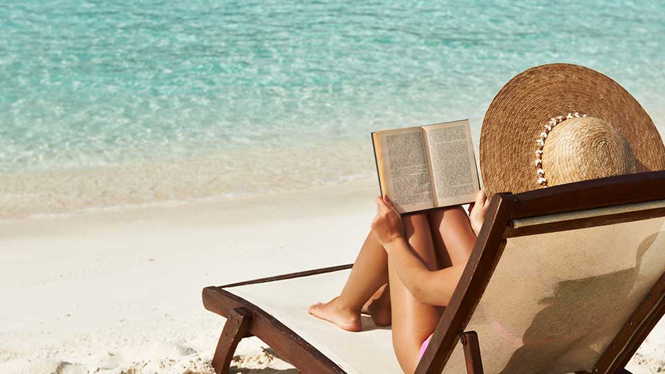 Woman reading on the beach