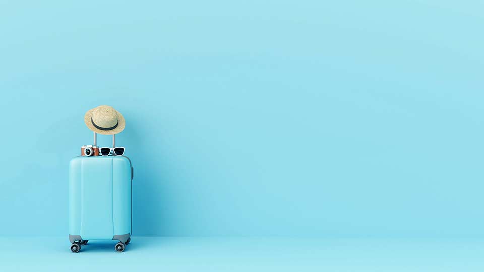 blue suitcase on blue background