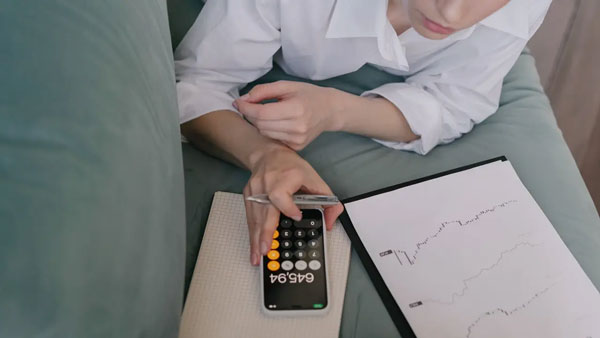 woman using calculator